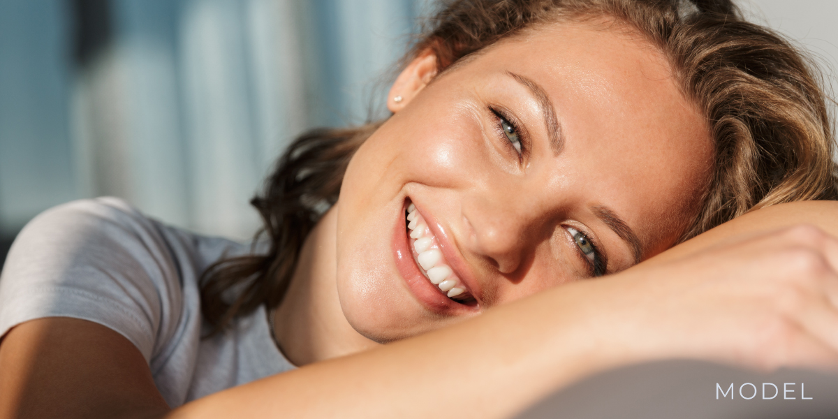 Woman Smiling and Laying Down