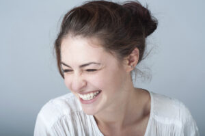 Smiling model in a white shirt