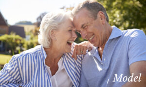 Mature couple touching foreheads | perri dermatology